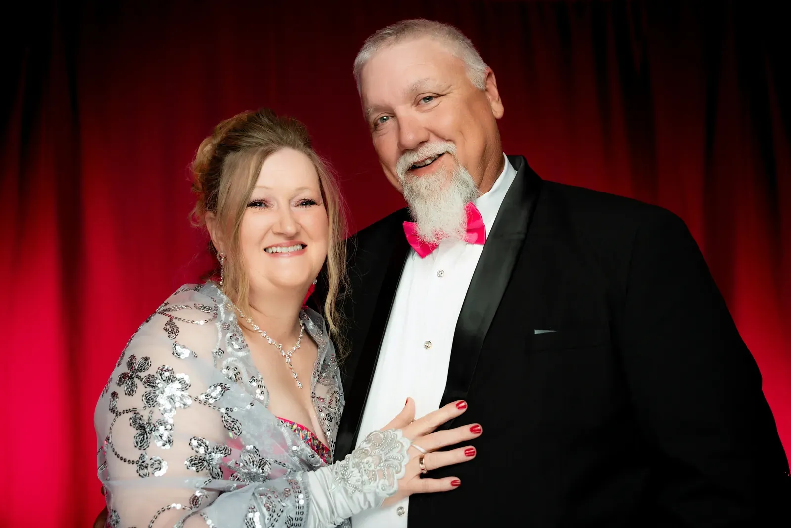 Close-up of a jeweled mask with feathers.