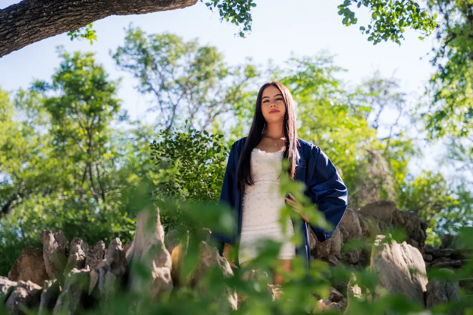 Action shot of Tayla flipping her hair on a bridge.