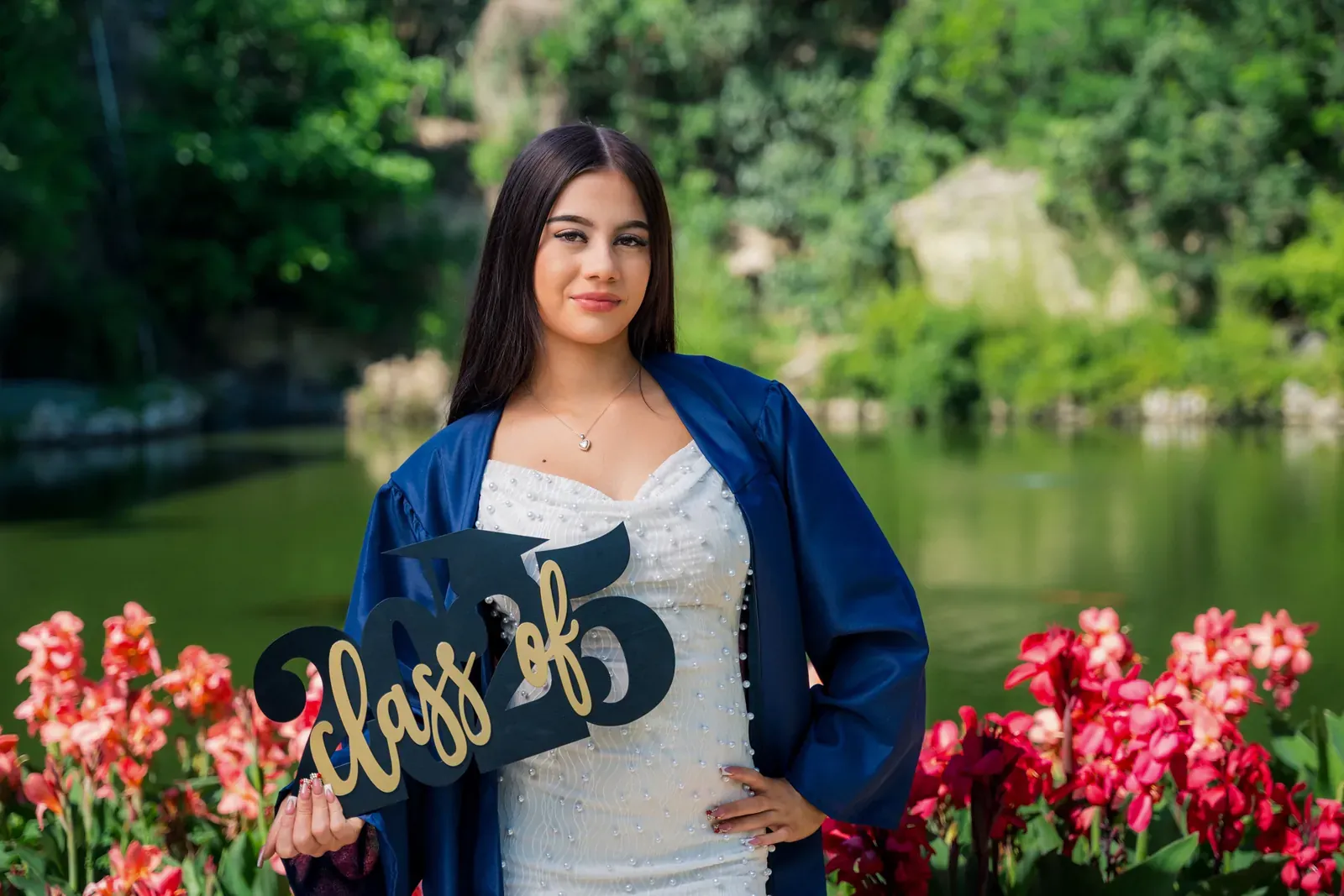 Portrait of Tayla seated on a rooftop at sunset.