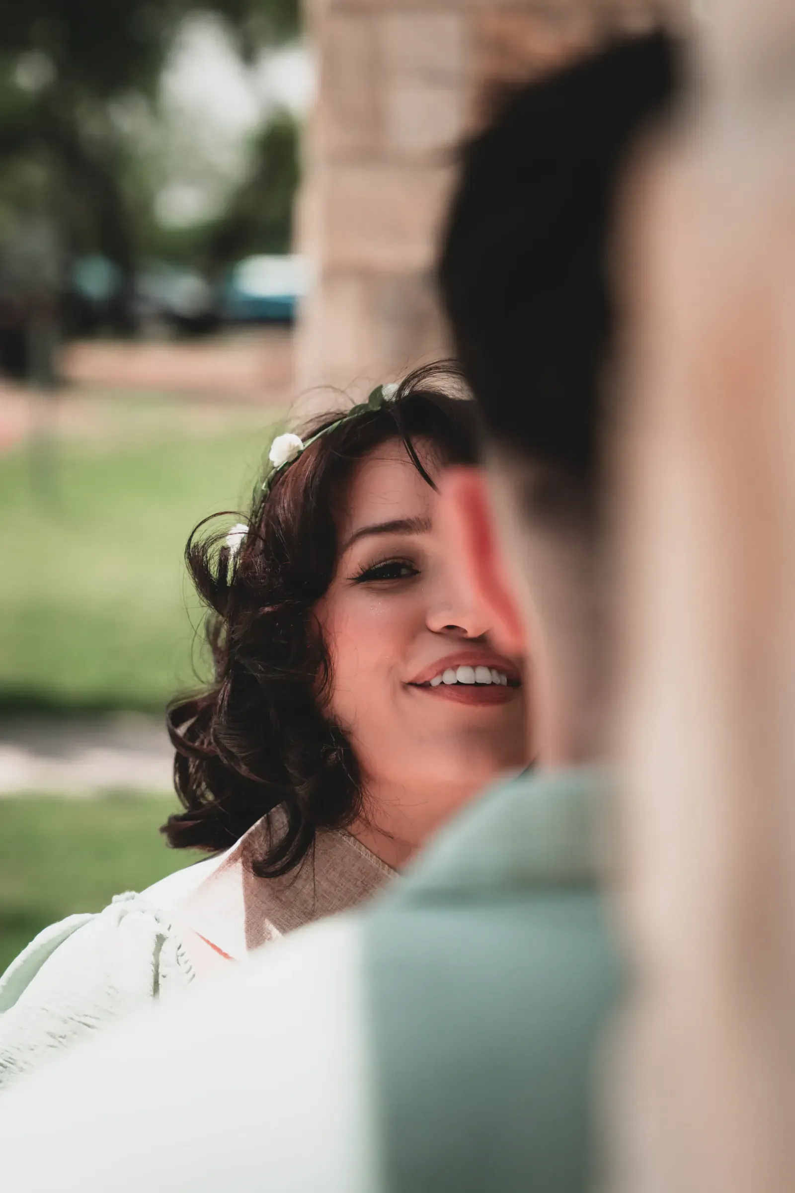Parents-to-be smiling during a toast.